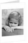 1930s portrait sad little blond girl peeking over her hands looking at camera by Anonymous