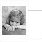 1930s portrait sad little blond girl peeking over her hands looking at camera by Anonymous