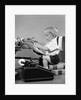 1950s child typing sitting at typewriter by Anonymous