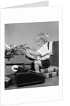 1950s child typing sitting at typewriter by Anonymous
