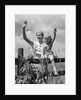 1930s girl sitting on fence with woman next to her in field waving by Anonymous