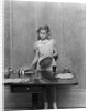 1940s blond pre-teen young woman setting table by Anonymous