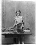 1940s blond pre-teen young woman setting table by Anonymous