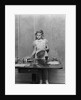 1940s blond pre-teen young woman setting table by Anonymous