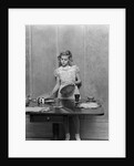 1940s blond pre-teen young woman setting table by Anonymous