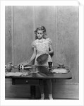 1940s blond pre-teen young woman setting table by Anonymous
