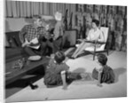 1960s family of four in living room boy is being disciplined by dad shaking finger by Anonymous