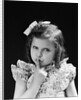 1950s child serious little girl pressing finger to lips hush be quiet secret by Anonymous