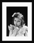 1950s child serious little girl pressing finger to lips hush be quiet secret by Anonymous