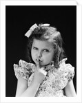 1950s child serious little girl pressing finger to lips hush be quiet secret by Anonymous