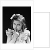 1950s child serious little girl pressing finger to lips hush be quiet secret by Anonymous