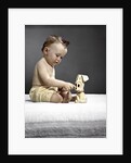 1940s 1950s baby sitting touching toy dog by Anonymous