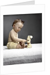 1940s 1950s baby sitting touching toy dog by Anonymous