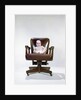 1960s chubby baby in diaper sitting in office executive chair by Anonymous
