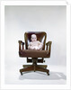 1960s chubby baby in diaper sitting in office executive chair by Anonymous