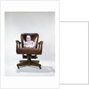 1960s chubby baby in diaper sitting in office executive chair by Anonymous