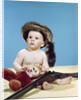 1960s baby boy wearing coonskin cap with stuffed animal and shotgun gun by Anonymous