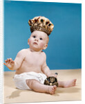 1960s baby wearing cloth diaper and crown holding a scepter by Anonymous