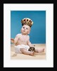 1960s baby wearing cloth diaper and crown holding a scepter by Anonymous