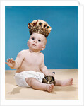 1960s baby wearing cloth diaper and crown holding a scepter by Anonymous