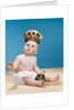 1960s baby wearing cloth diaper and crown holding a scepter by Anonymous
