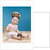 1960s baby wearing cloth diaper and crown holding a scepter by Anonymous