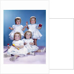 1950s 1960s quadruplet portrait 4 red haired girls wearing dresses two seated 2 standing by Anonymous