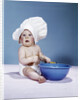 1950s 1960s baby wearing chef hat toque holding spatula blue mixing bowl by Anonymous
