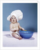 1950s 1960s baby wearing chef hat toque holding spatula blue mixing bowl by Anonymous