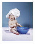 1950s 1960s baby wearing chef hat toque holding spatula blue mixing bowl by Anonymous