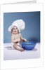 1950s 1960s baby wearing chef hat toque holding spatula blue mixing bowl by Anonymous