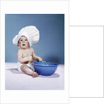1950s 1960s baby wearing chef hat toque holding spatula blue mixing bowl by Anonymous