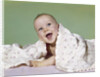 1960s smiling happy baby peeking out from under a blanket by Anonymous