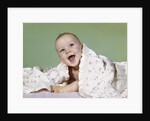 1960s smiling happy baby peeking out from under a blanket by Anonymous