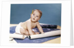 1960s baby architect sitting among blueprints by Anonymous