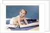 1960s baby architect sitting among blueprints by Anonymous