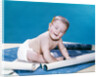 1960s baby eyes closed funny facial expression crawling on rolling out blueprints by Anonymous