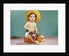 1960s baby wearing cowboy hat and holster with guns pistols looking at camera by Anonymous