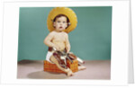 1960s baby wearing cowboy hat and holster with guns pistols looking at camera by Anonymous