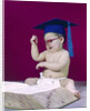 1960s graduate baby wearing mortarboard eyeglasses reading book by Anonymous