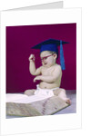 1960s graduate baby wearing mortarboard eyeglasses reading book by Anonymous