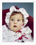 1960s baby wearing raincoat and hat by Anonymous