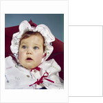 1960s baby wearing raincoat and hat by Anonymous