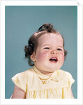 1960s smiling baby open mouth showing two new teeth gums teething by Anonymous
