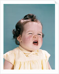 1950s 1960s unhappy crying baby mouth open showing new teeth teething pain by Anonymous