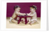 1960s two babies sitting at red stool playing cards poker with gambling chips by Anonymous