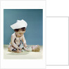 1960s baby wearing nurse nurse's cap stethoscope listening to doll heartbeat chest by Anonymous