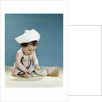 1960s baby wearing nurse nurse's cap stethoscope listening to doll heartbeat chest by Anonymous