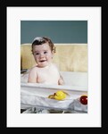 1960s smiling baby in bath looking at camera by Anonymous