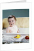 1960s smiling baby in bath looking at camera by Anonymous